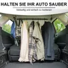 The interior of a car with clothes hanging on a telescopic rod. Produktbild-Vorschau