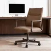 A brown office chair is placed in front of a desk with a computer monitor. Náhľad obrázku produktu