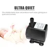 A baby sleeping next to a water pump. Podgląd zdjęcia produktu