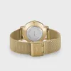 The back of a gold-colored watch with a mesh band is shown against a white background. Voir les images du produit