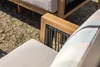 Close-up of outdoor lounge furniture with wooden frames and woven rope details. Produktbild-Vorschau