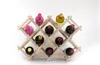 A wooden wine rack filled with various bottles of wine. Produktbild-Vorschau