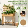 A wooden planter box with a trellis, showing plants and gardening tools. Produktbild-Vorschau