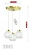 A product image of a three-light pendant lamp with white glass globes and gold accents, shown against a white background with measurement indicators. Podgląd zdjęcia produktu