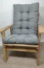 A close-up view of a grey cushion on a wooden chair. Produktbild-Vorschau