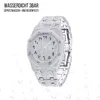 A diamond-encrusted watch with Arabic numerals on a white background with water droplets. Produktbild-Vorschau