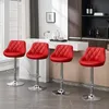 Four red bar stools are arranged in a modern kitchen setting. Produktbild-Vorschau