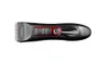 A top-down view of a black electric hair clipper with red accents, set against a white background. Produktbild-Vorschau