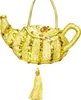 A golden teapot-shaped handbag with sequins and a tassel, displayed against a white background. Produktbild-Vorschau