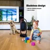 A baby and a dog are playing on the floor near a heater in a living room. Anteprima dell’immagine prodotto