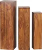 Three wooden pedestals of varying heights are arranged side-by-side against a white background. Produktbild-Vorschau