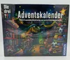 The image shows the front of a board game box for an advent calendar. Produktbild-Vorschau