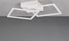 A modern white ceiling light with geometric shapes is mounted on a white ceiling against a gray background. Náhľad obrázku produktu
