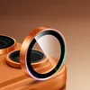 Close-up of a phone camera lens protector with an orange metallic rim. Anteprima dell’immagine prodotto