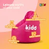 A pink beanbag chair for children is shown with various feature callouts. Náhled obrázku produktu