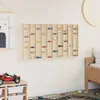 A wall display case filled with toy cars in a child's room, next to a bed and a toy shelf. Náhled obrázku produktu