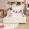 A child's bedroom decorated for Christmas, featuring a white bed, nightstand, and stool. Voir les images du produit