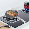 A steak is being fried in a pan on a stovetop, with a pot of water boiling in the background. Podgląd zdjęcia produktu
