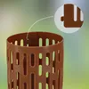 A close-up view of a brown plastic tree guard with a magnified inset showing a detail of its interlocking mechanism. Produktbild-Vorschau