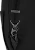 A close-up of a black backpack strap with a metal clasp and a Pacsafe logo. Produktbild-Vorschau