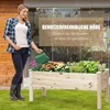 A woman is watering a raised garden bed filled with flowers and herbs. Anteprima dell’immagine prodotto