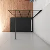 A modern bathroom shower enclosure with a black frame and glass panels, set against a wood-paneled wall and white tiled wall. Produktbild-Vorschau