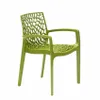 A single green chair with an intricate, web-like design on the back and seat, shown against a white background. Produktbild-Vorschau