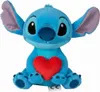 A blue Stitch plush toy holding a red heart. Podgląd zdjęcia produktu