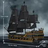 A detailed model of a pirate ship with black sails and gold accents, set against a stormy sky. Podgląd zdjęcia produktu