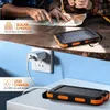 A split image showing a solar power bank being used in two different scenarios: charging via solar panel outdoors and charging via wall outlet indoors. Produktbild-Vorschau