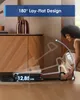 A woman is using a vacuum cleaner that is shown in a low-profile position under a cabinet. Produktbild-Vorschau