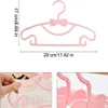 A collage of images showing pink hangers with dimensions. Produktbild-Vorschau