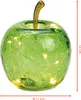 A green glass apple with embedded LED lights and a gold stem, with size indicators on the right and bottom. Voir les images du produit