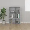 A modern, minimalist living room with a gray wall and wooden floor, featuring a gray concrete-effect bookshelf filled with decorative items and books. Produktbild-Vorschau