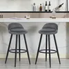 Two dark gray bar stools with black legs are placed in front of a kitchen counter. Produktbild-Vorschau