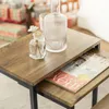 A close-up shot of a nesting side table set with decorative items on top. Voir les images du produit
