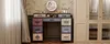 A bedroom or dressing room setting with a vanity and wardrobe. Produktbild-Vorschau