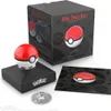 A Pokémon Mini Poké Ball replica is displayed with its packaging and accessories. Náhľad obrázku produktu