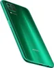 A green Huawei P40 Lite smartphone shown from a diagonal angle, highlighting its rear camera module and glossy finish. Produktbild-Vorschau