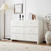 A white dresser with six drawers is shown in a well-lit room with a floor lamp and a vase with branches. Anteprima dell’immagine prodotto