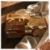 Kandylas Bio Halva Kakao 400 g Verpackung auf seidenartigem Stoff Produktbild-Vorschau