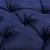 A close-up view of a dark blue tufted cushion. Produktbild-Vorschau