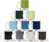 A pyramid stack of Pantone mugs in various colors. Produktbild-Vorschau