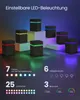 Several small, square LED lamps with different colored lights arranged on a dark surface with a gradient background. Produktbild-Vorschau