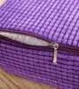 A close-up of a purple, textured cushion with a partially unzipped zipper revealing white filling. Produktbild-Vorschau