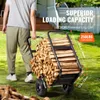 A person is pushing a log cart filled with firewood outdoors. Voir les images du produit