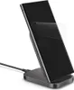 A smartphone is placed on a wireless charging stand, with a protective film partially peeled off the phone's screen. Podgląd zdjęcia produktu