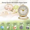 A child sleeping next to an alarm clock, with various sound level comparisons shown below. Produktbild-Vorschau
