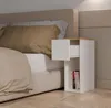 A bedside table next to a bed. Anteprima dell’immagine prodotto