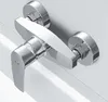 A close-up studio shot of a modern chrome and white shower faucet. Produktbild-Vorschau